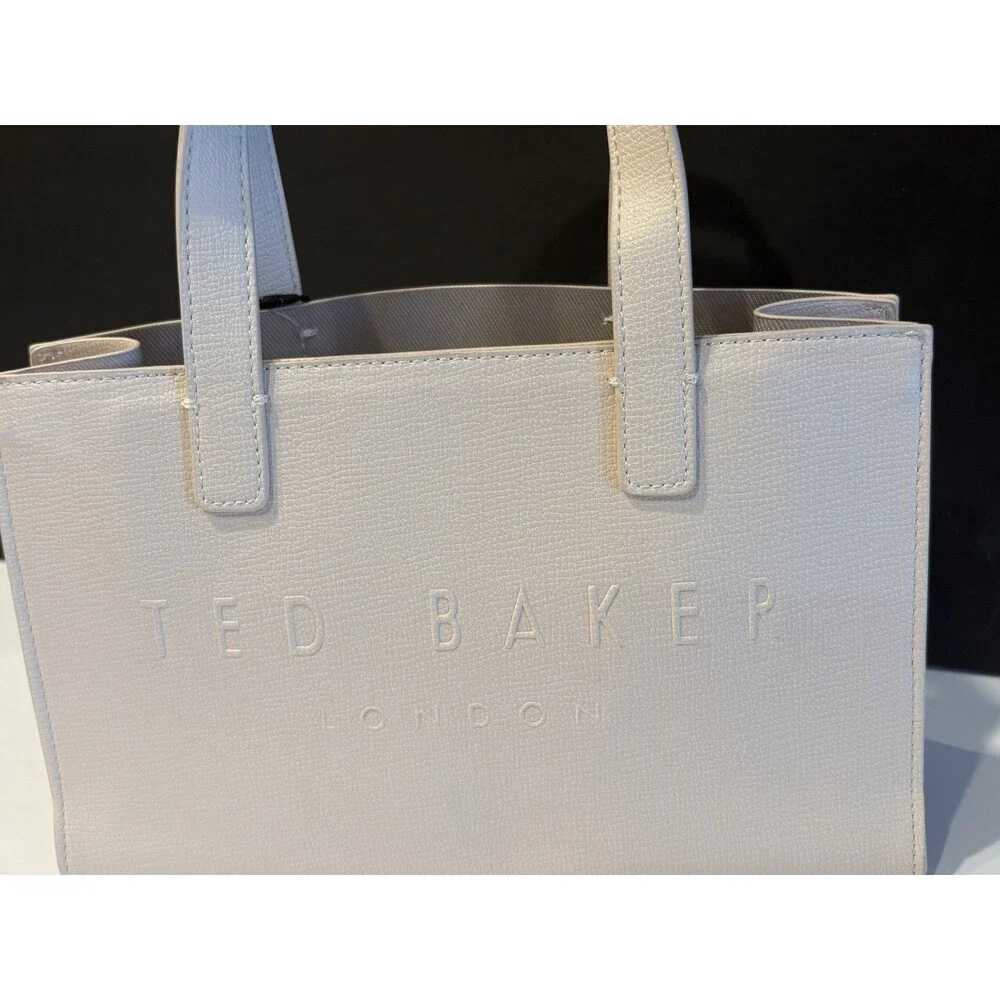 Ted Baker Icon small tote bag in a cream-colored, structured material.